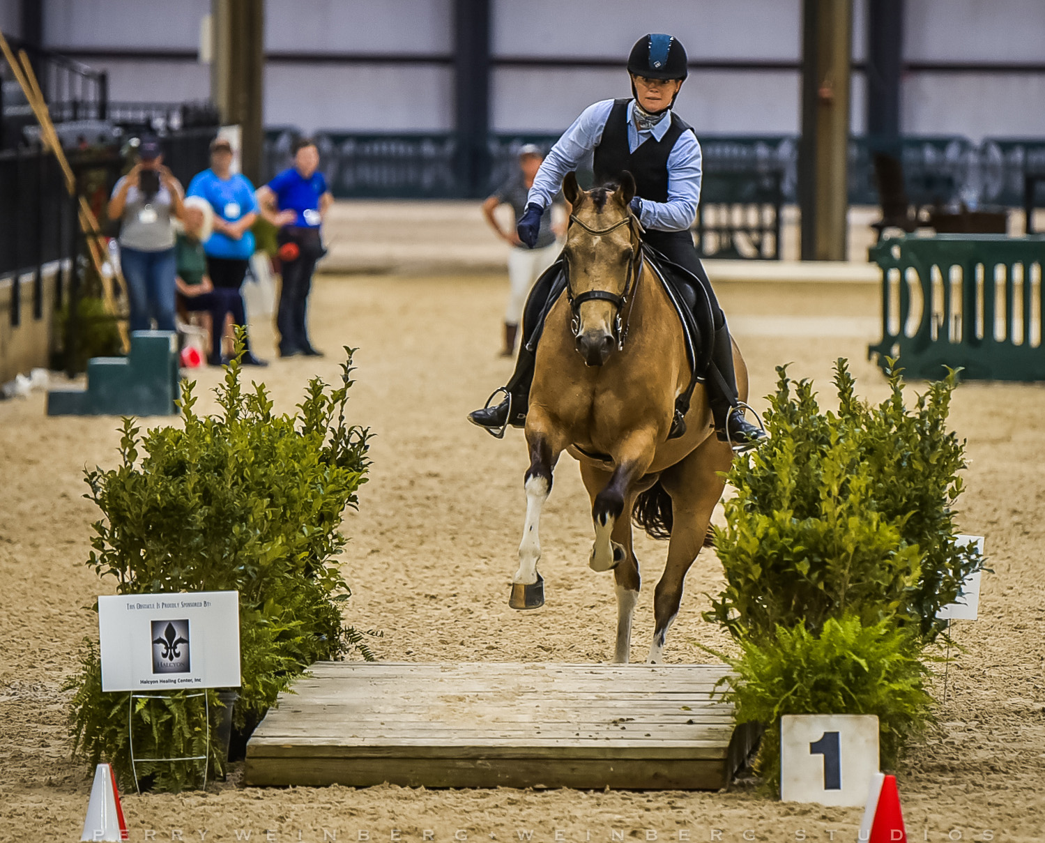 Jody Fontanetta riding over WE Bridge obstacle