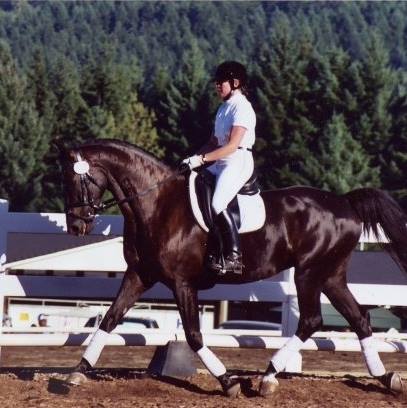 Image of Tracey Erway riding her horse Malcom.